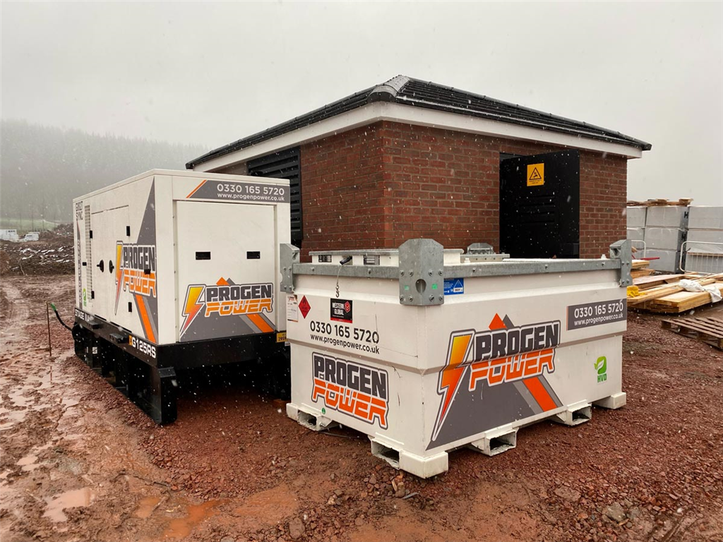 HVO Generator and extra fuel cube providing temporary power to a new housing development in Wales.  Gallery Image