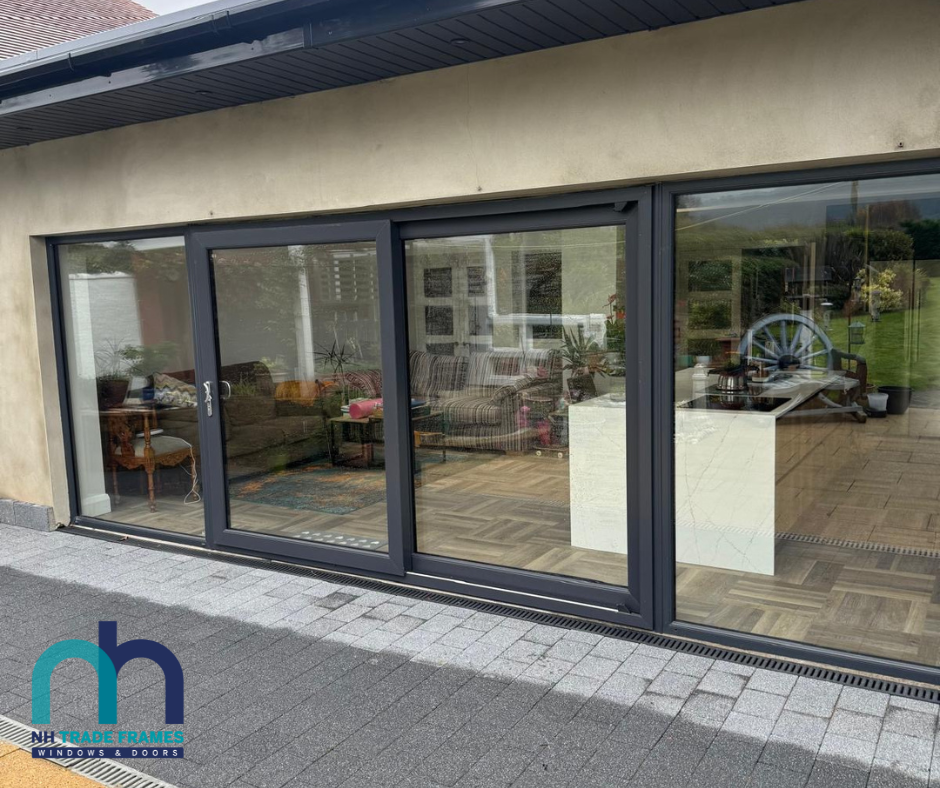 Grey, PVC, double glazed, Sliding Patio doors installed with matching sidelights. Gallery Image