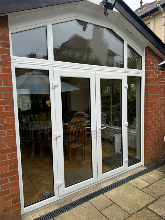 Maximising natural light...French doors, side lights and arched overhead glass panelling Gallery Image